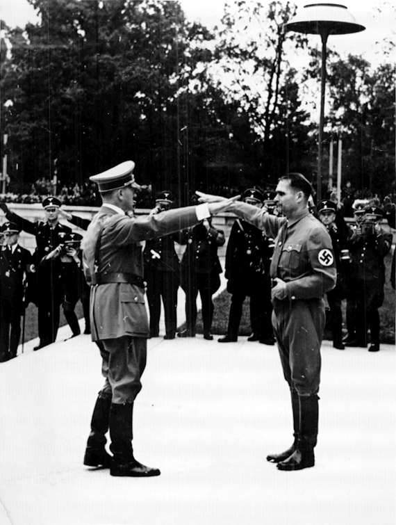 Adolf Hitler salutes Rudolf Hess at the opening of the 1938 Reichsparteitag